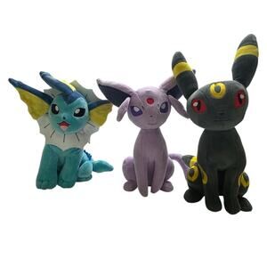 Set of Pokémon plush toys, specifically Vaporeon, Espeon, and Umbreon